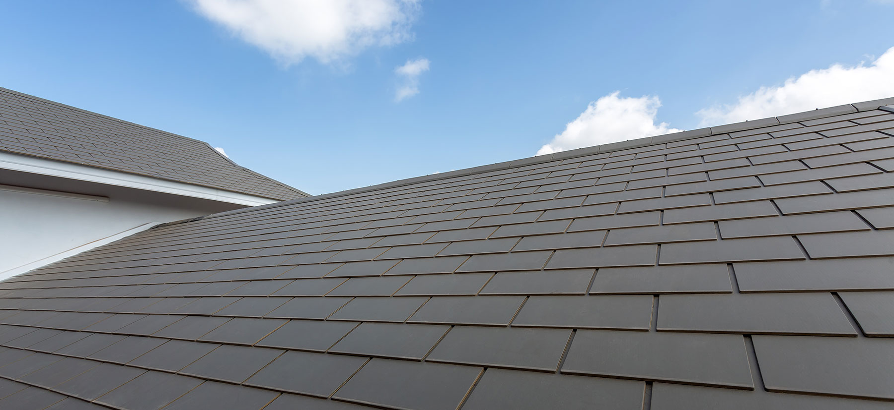 Professional roofing crew working on a beautiful Southern California home
